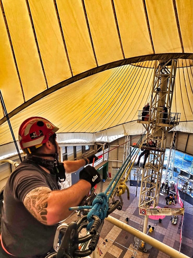 Technical rescue practitioner working ropes at height during training